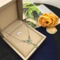 Close-up view of the exquisite green butterfly pendant necklace detail, elegant style. - Butterfly Style X1312