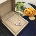 Exquisite butterfly heart pendant necklace detail in elegant beige jewelry gift box display. - Butterfly Style X1318