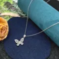 Close-up detail of silver crystal butterfly pendant necklace, elegant jewelry showcase. - Butterfly Style X1296