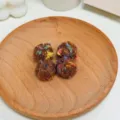 Closeup of colorful dotted yarn balls for DIY jewelry making and handmade crafts detail shot - Coffee Spotted Winding Ball