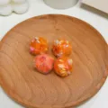 Close-up of colorful dot wool yarn balls, knitted straight hole DIY jewelry accessories beads. - Orange Spotted Winding Ball