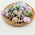 Close-up detail of colorful faux mink fur large hole beads with metallic golden grommets. - Random Mixed Colors