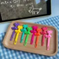 Colorful plastic bow hair clips and fruit picks set, stylish bright accessories for girls. - Multicolor