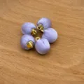 Detailed view of lavender satin fabric covered round shank buttons for DIY sewing crafts. - Satin Purple