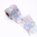 Close up view of rainbow gradient tulle ribbon with floral pattern, for DIY crafts and bows. - MG-1 Rainbow Blue Pink 7.5cm