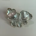 Designer style pearlescent butterfly jewelry accessory, elegant metallic finish detail shot. - Ring (3874)