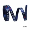 Dark blue satin ribbon with white Let's Get Lit text, red stars, 9mm width for crafts. - Dark Blue With Letter Print And Red Star (201226) / 100 Yards Per Pack