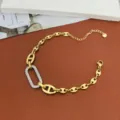 Gold stainless steel link bracelet featuring a sparkling zircon oval pendant design. - Bracelet / Color Block