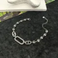 Bracciale catena ancora in acciaio inox con dettaglio ovale in zircone, gioiello argento. - Bracciale / Argento