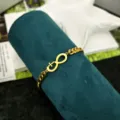 Bracciale in acciaio inossidabile dorato con ciondolo simbolo speciale gioiello moda da donna - Braccialetto a Catena Cubana con Fiocco / Oro