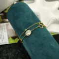 Raffinato bracciale in acciaio inossidabile dorato con doppio strato, quadrifoglio e zircone. - Braccialetto a Doppio Strato con Zirconia Bianca / Oro