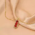 Squisita collana con ciondolo arachide in acciaio al titanio oro rosa con zirconi lucenti. - Arachide Rossa Baccello (Catena a Croce) / Oro rosa
