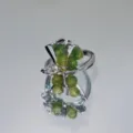 Close-up view of the handmade green stone beaded silver ring with unique molten design. - Style 01 (Green Stone Lava Open)