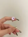 Close-up detail of the cute pink cat eye silver ring, showing unique monster design. - Single Eye Shape (R-264) / Single Purple Eye