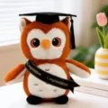 Adorable graduation owl plush toy featuring mortarboard cap and sash, perfect gift. - Black Sash Style