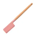 Pink silicone spatula with wooden handle, kitchen cooking tool for baking and cooking. - Spreader