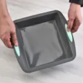 Square silicone baking pan with green handles for cakes, bread, and DIY pastry making. - Gray