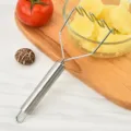 Stainless steel potato masher with wavy wire design and ergonomic handle for food prep. - Silver