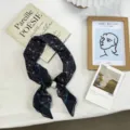 Detailed view of a chic black paisley silk scarf featuring an elegant pearl buckle. - One Size / 03#-Black Paisley