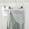 Sheer striped triangular scarf waist accessory layered over denim pants for women chic style. - Gray Stripe