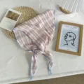 French style pink plaid triangle headscarf featuring delicate blue edge trim, detail shot. - Red