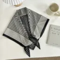 Close-up of a black and white striped triangle scarf, stylish geometric pattern detail. - Retro Black White Striped / 130*65cm