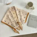 Detailed view of vintage polka dot triangular scarf, elegant retro design accessory. - Retro Champagne Polka Dot / 130*65cm