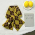 Close-up detail of stylish yellow brown argyle knit wool winter scarf with cozy pattern. - 88*16cm / Mustard Yellow