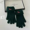 Detail view of cute dog embroidered touchscreen knit gloves in dark green, cozy winter warmth. - One Size / Green