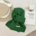 Green knitted scarf detailed view, soft woolen fabric with classic grid pattern for winter. - 146x22cm / Green