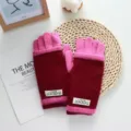 Detailed view of color-blocked knitted gloves, soft and warm winter wear with small label design. - 22*9cm / Burgundy