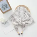 Detail view of vintage floral tie-up triangular scarf, textured fabric with beaded string. - 124*26cm / Grayish White