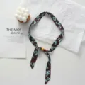 Detailed view of the brown floral fabric ribbon scarf with wooden beads, showcasing texture. - Brown With Blue Floral (07#) / 45x2.5cm