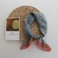 Detail view of a vintage floral square scarf, soft breathable fabric with stylish print. - 55*55cm / Cyan Blue