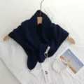 Detailed view of the dark blue knit shoulder shawl scarf with colorful speckles and hollow-out design. - 100x40cm / Navy Blue