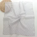 Detail shot of white cotton linen small square scarf with blue geometric triangle pattern. - Blue