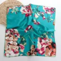 Detailed view of a turquoise floral silk square scarf, perfect for hair or neck styling. - 01#-Plum Blossom