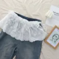 White lace ruffled apron waist extension skirt paired with blue jeans balletcore style. - One Size / Cotton Ballet Style