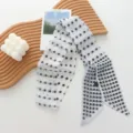 Detailed close-up shot of the elegant black and white polka dot skinny ribbon scarf. - 07#-Polka Dot Scarf