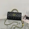 Black quilted leather shoulder bag with gold chain handle and elegant design for women. - Black