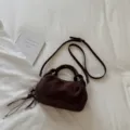 Retro brown suede handbag, chic pleated dumpling crossbody bag for women daily fashion style. - Brown with Pendant
