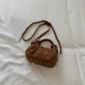 Brown suede dumpling handbag for women, chic knotted handle shoulder and crossbody bag. - Brown No Pendant