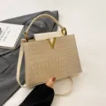 Chic crocodile pattern leather handbag, stylish top handle tote bag with metal V clasp. - Off White