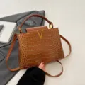 Stylish crocodile pattern women handbag with metal V clasp, versatile tote and shoulder bag. - Tan