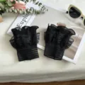 Black lace wrist cuffs detail view, delicate pleated mesh decorative false sleeves design. - One Size / Striped Black Lace