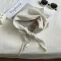 Detailed view of solid color linen triangle scarf, breathable Mori style neck wrap for daily wear. - 100x28cm / Beige