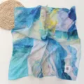 Detailed shot of abstract oil painting style blue silk scarf with corner tag texture. - 64*64cm / Sky Blue