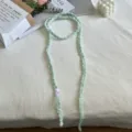Handmade crochet green ribbon choker necklace detail flat lay stylish accessories - Green