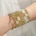 Gold beaded and pearl layered stacked bracelet set with cross charm for women variant. - Metal Pearl Cross Combo (XY-235+XY-1717 Combo) / Multi-piece Bracelet Set