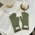 Green knitted winter gloves for women featuring brown trim cuffs and cozy daily wear. - One Size / Green